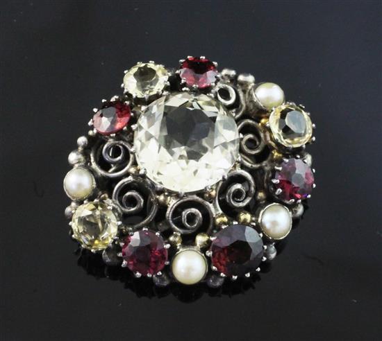 An early 20th century Arts & Crafts silver, citrine, garnet and split pearl set clip. approx. 1.5in.